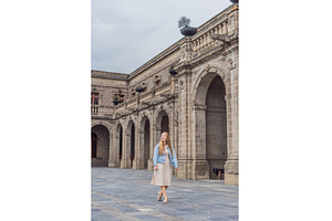 Young woman tourist standing near, an Architecture Photo by Elizaveta Galitskaya