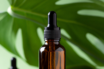 glass brown bottle with a cosmetic p