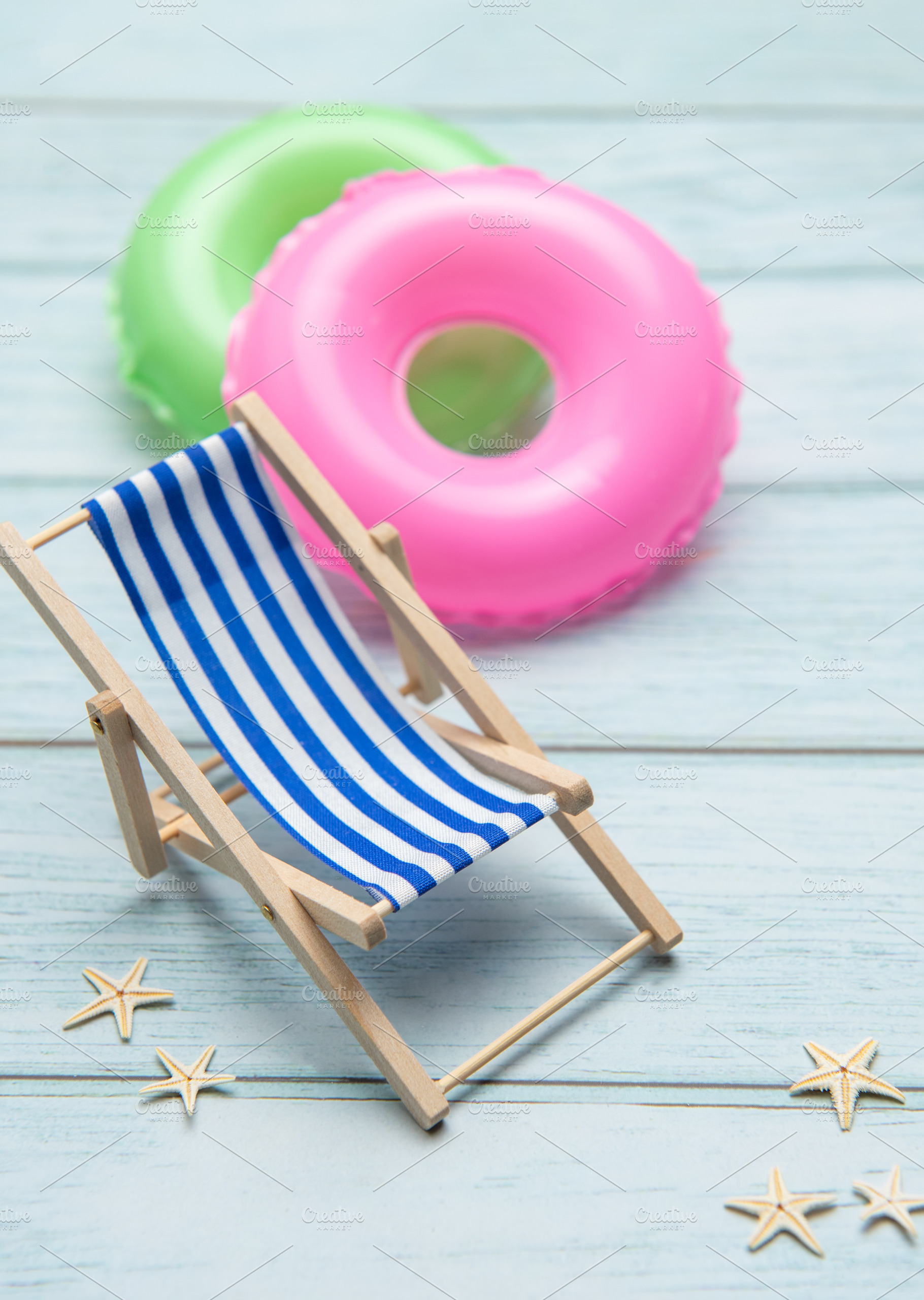 Relaxing beach vibes with colorful pool floats, a Holiday Photo by Olena Rudo