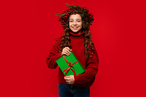 Girl in Christmas berry wreath, a Holiday Photo by Elena Vagengeim