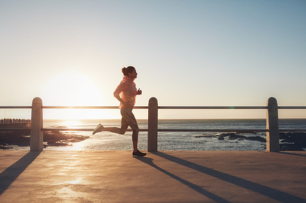 Fit and young woman running, a Sports & Recreation Photo by Jacob Lund