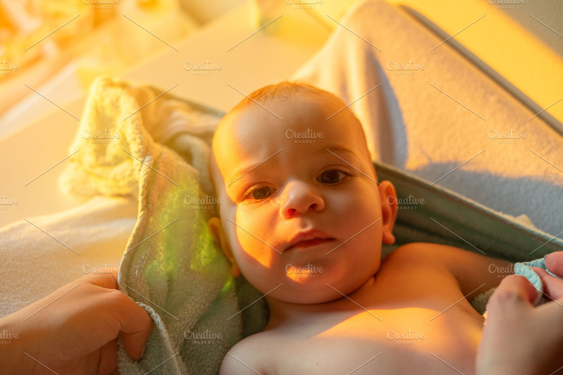 Portrait of a nine month old baby after bath time, a Person Photo by rubenchase