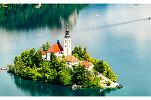 Aerial view of bled island in containing slovenia, island, and bled, an Architecture Photo by Leonid Andronov