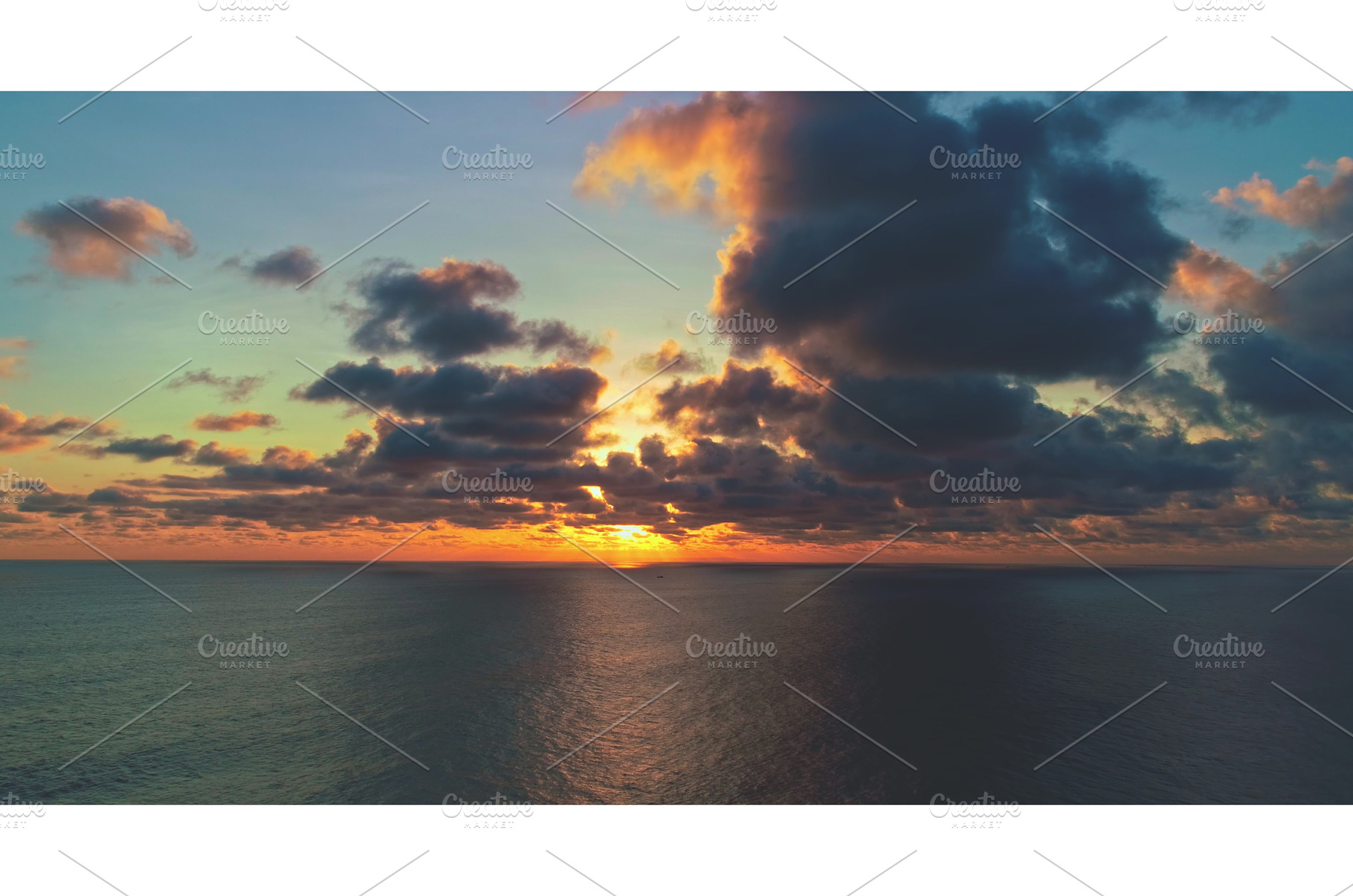 Sun setting over calm ocean with, a Nature Photo by Goinyk