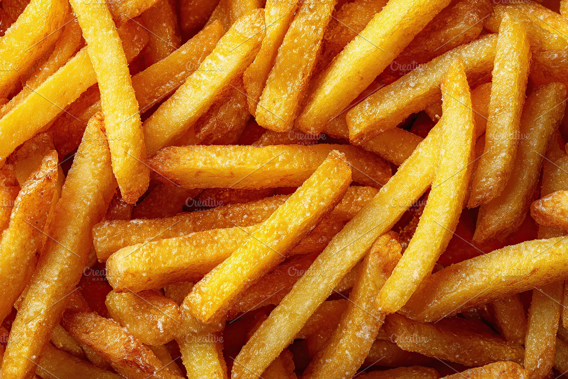 Crispy fried french fries served on a rustic wooden surface during a sunny outd, a Background Photo by AlyaAnd