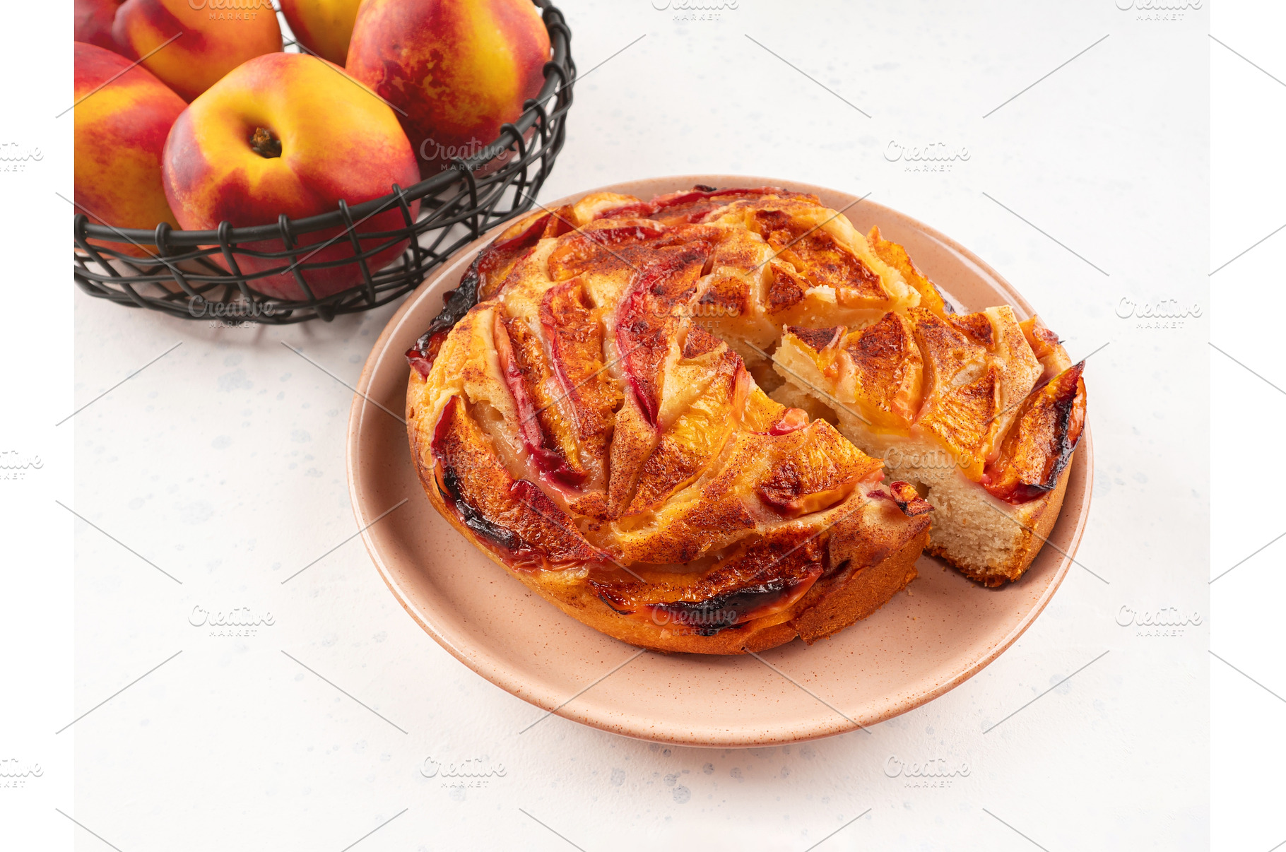 Vegan nectarine peach cake on white, a Food & Drink Photo by Lifemorning