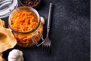 Spicy korean carrot salad in jar, a Food & Drink Photo by Yulia Furman