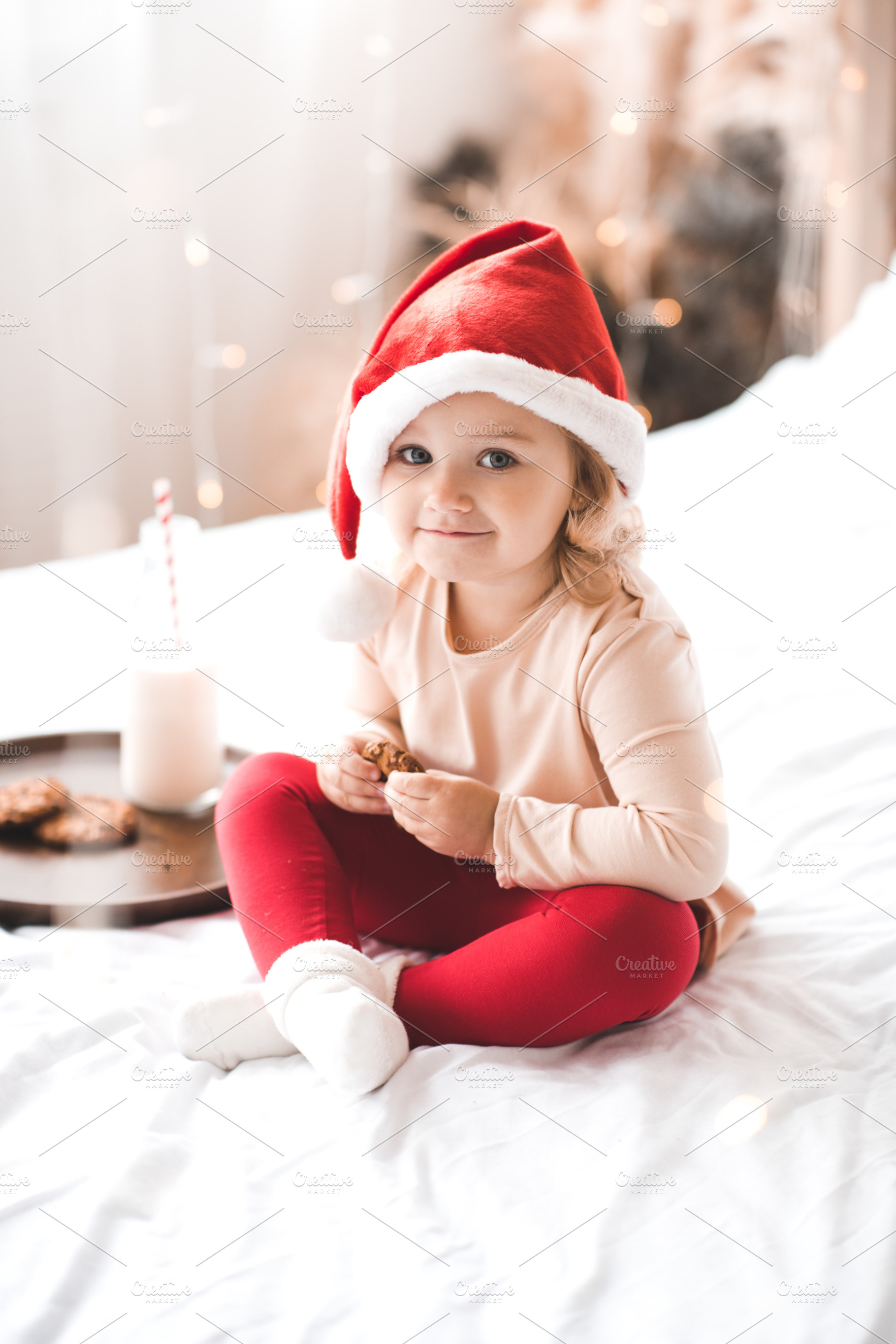 Baby girl with breakfast in bed, a Person Photo by morrowlight