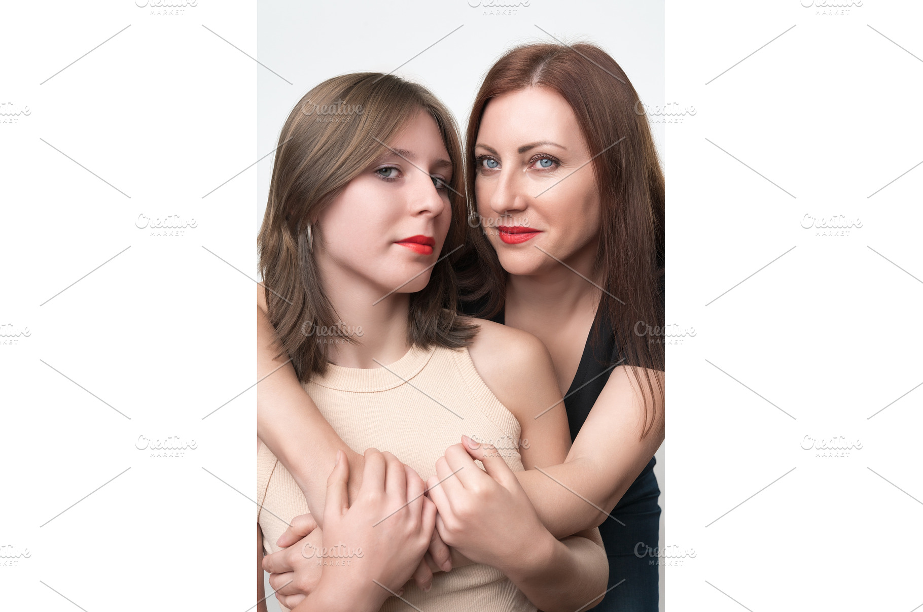Adult mother gently hugs her teenage, a Person Photo by Alexander-Piragis