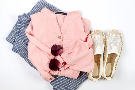 Set of seasonal summer fashion woman clothes, top view. Women's, a Photo by vimart