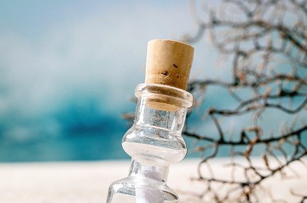 Summer sand sea beach with waves and glass botle with message, a Nature Photo by Natasha Breen