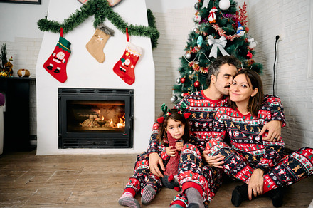 Family wearing matching Christmas pajamas, a Holiday Photo by YossSabalet