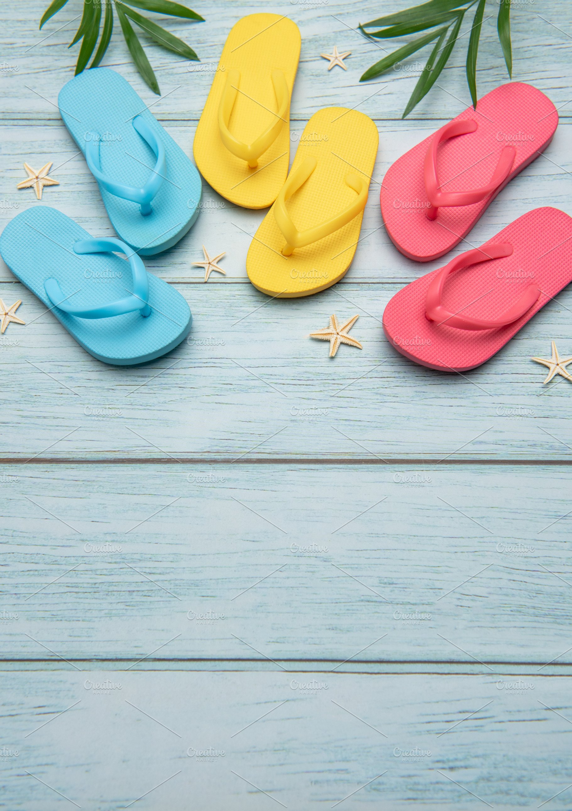 Colorful flip flops and starfish creating summer vacation atmosp, a Holiday Photo by Olena Rudo