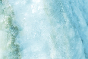 Horizontal lightened slices of blue stock photo containing marble and ice