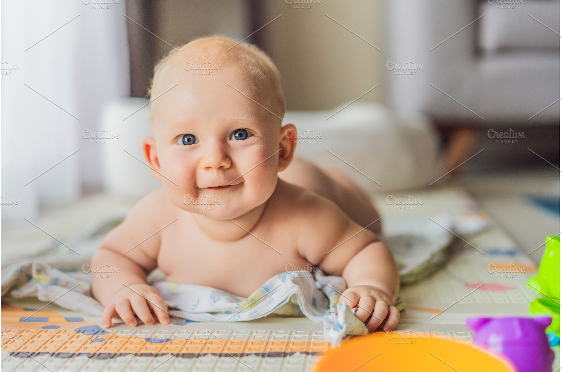 Little baby playing with toys on a, a School & Education Photo by Elizaveta Galitskaya