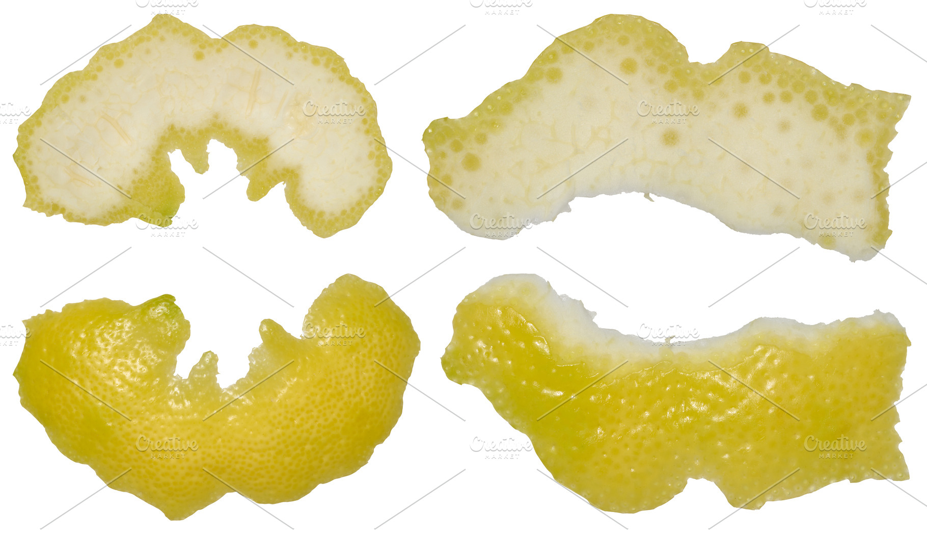 Four pieces of lemon peel in different shapes showing the white, a Food & Drink Photo by ndanko