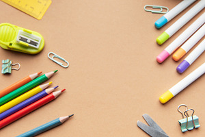 School supplies and apple on desk for education learning