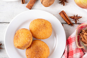 Tasty homemade apple pie autumn tasty donuts with cinnamon sugar, a Food & Drink Photo by Rimma