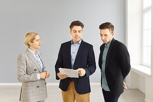 Realtor Briefing Couple on Papers