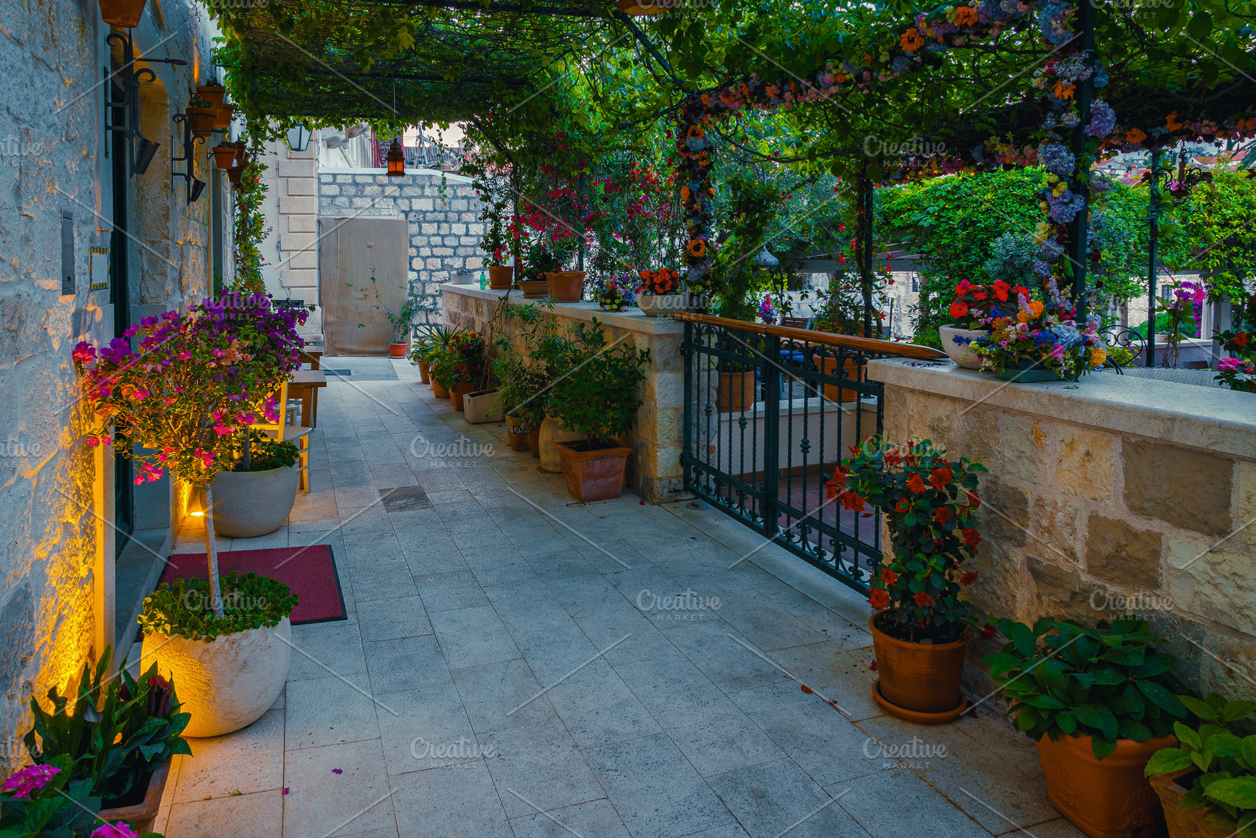 Cozy street decorated with flowers, an Architecture Photo by Alpine Dreams