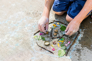 Child playing outside with natural m, a Photo by Dvoevnore photos
