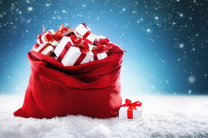 Santa's red sack on snow filled with gifts blue isolated, a Holiday Photo by Davizro's Market