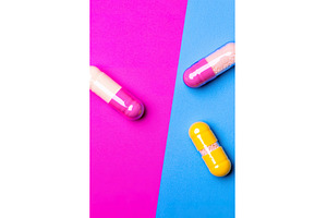 Colorful capsules on pink and blue, an Arts & Entertainment Photo by Lermont51