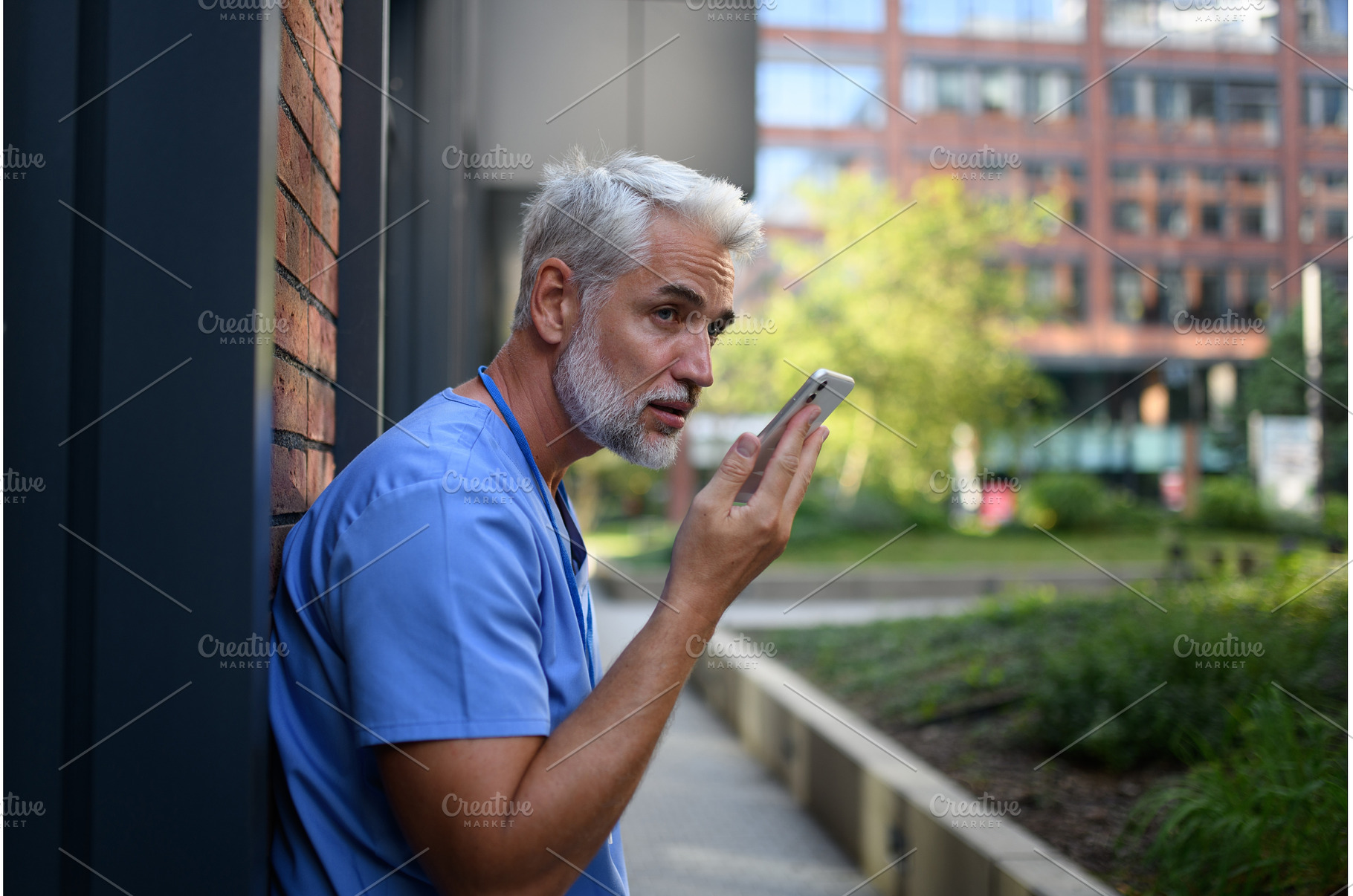 Doctor recording a voice message to, a Health & Medical Photo by HalfPoint