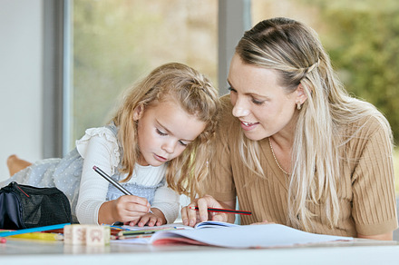 Mother help youth girl with school work, homework or preschool education while writing in notebook. Mom helping, teaching or tutor daughter, student or young learning kid in math, history or english, a Photo by Peopleimages.com