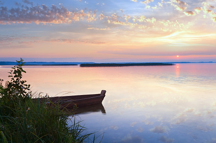 Sunset with boat near the summer lake shore, a Nature Photo by YuriyB