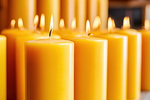 Collection of yellow candles on wooden shelf, a Beauty & Fashion Photo by AlyaAnd