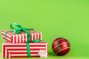 Bright high-colored background with Christmas boxes, festive bau