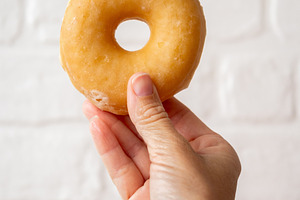 Hand Holding Glazed Donut, a Food & Drink Photo by etorres69
