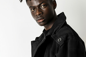 Afro man in black jacket, a Person Photo by Hamza067