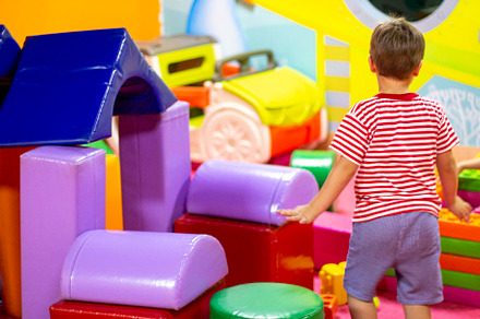 boy playing with building toy blocks