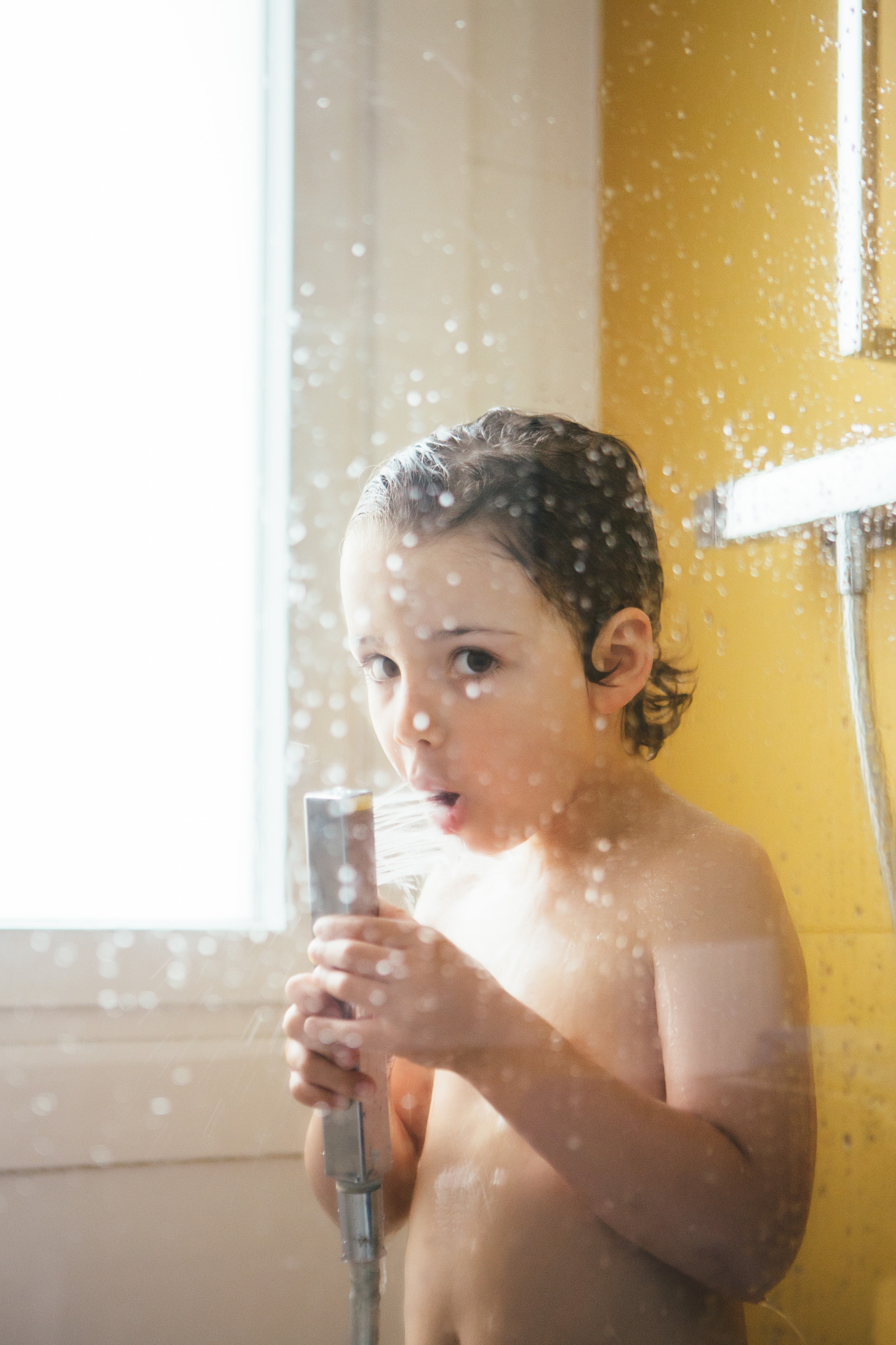 Little boy having shower at bathroom stock photo containing child and