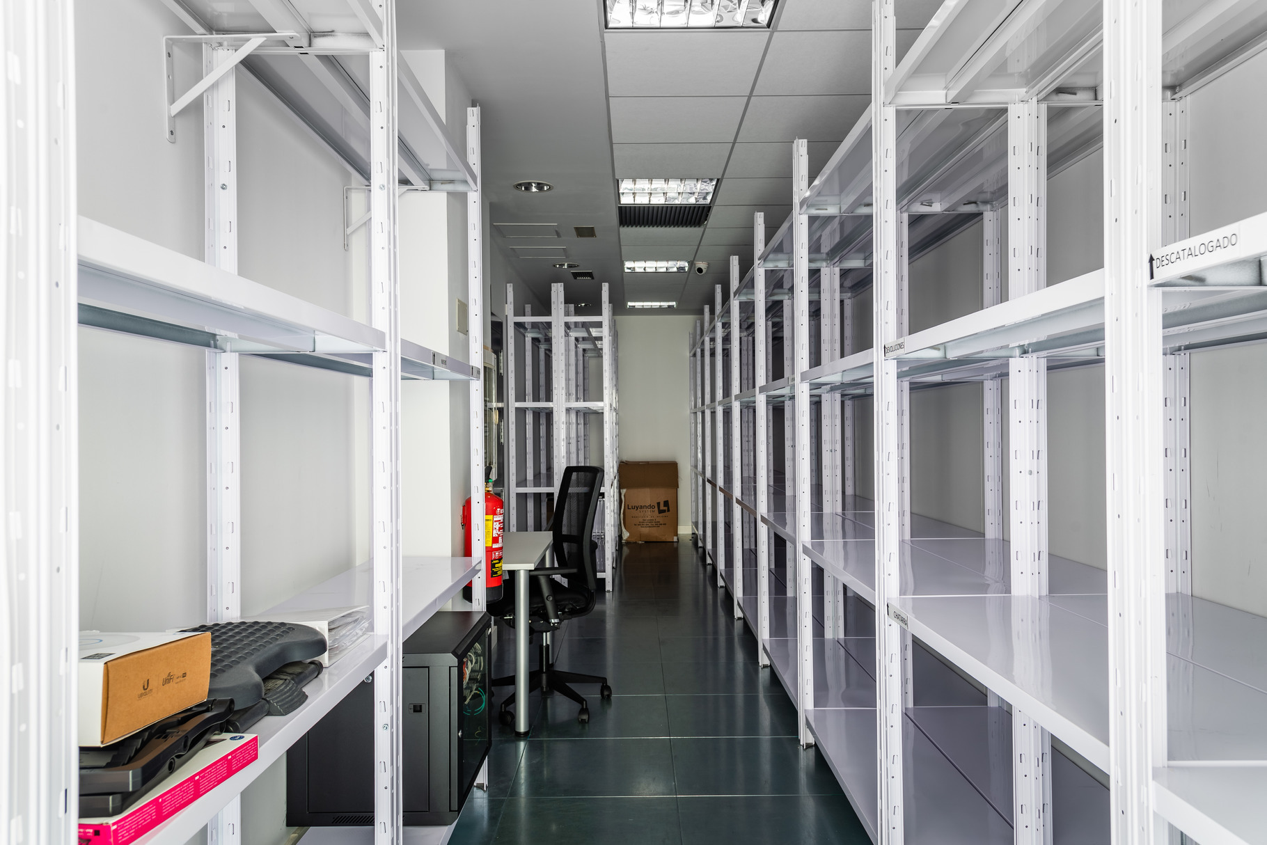 Empty storage room in coworking space with empty shelves, a Business ...