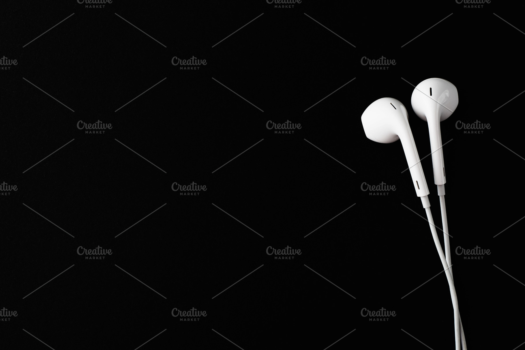 White Earbuds or Earphones on black, a Technology Photo by Klever Level Studio