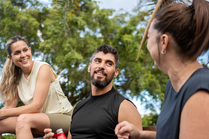 Group of fitness friends talking and relaxing after outdoor workout, a Sports & Recreation Photo by etorres69