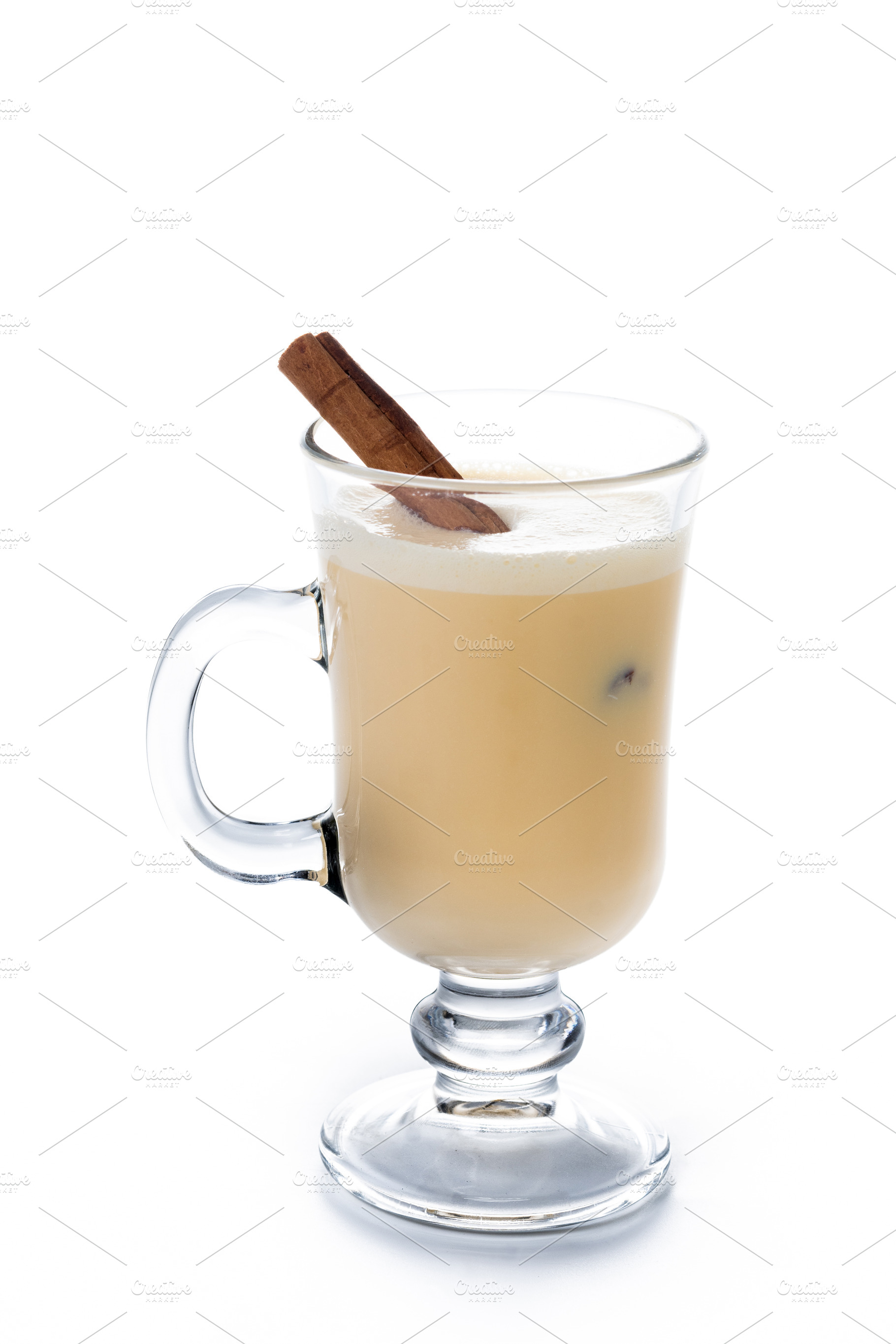 Glass of eggnog with cinnamon sticks, a Food & Drink Photo by etorres69