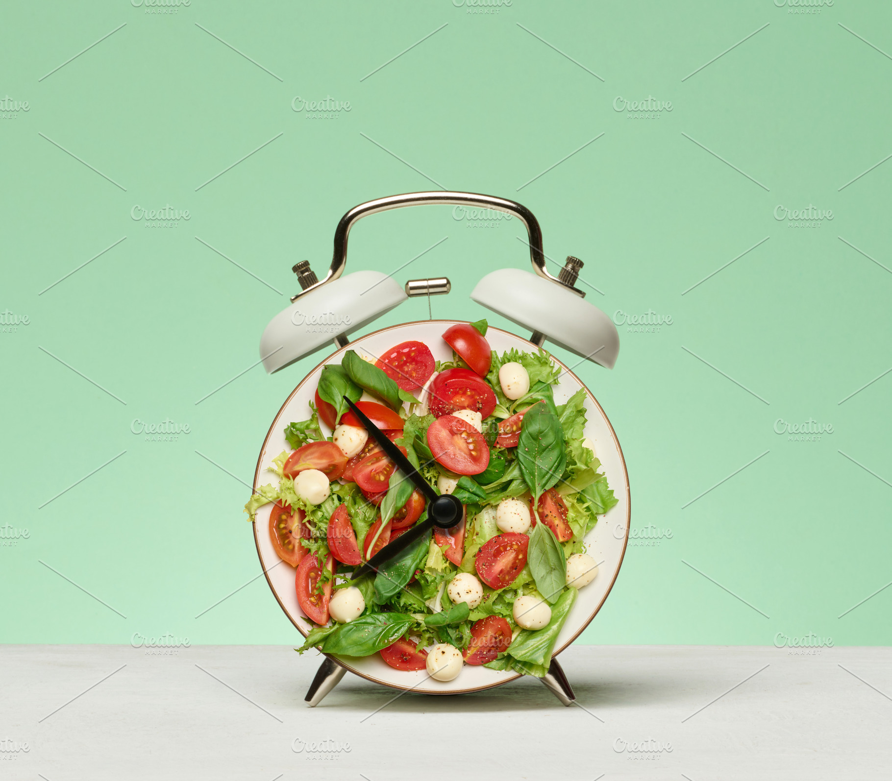 The white alarm clock dial is replaced by a fresh salad of cherr, a Food & Drink Photo by ndanko
