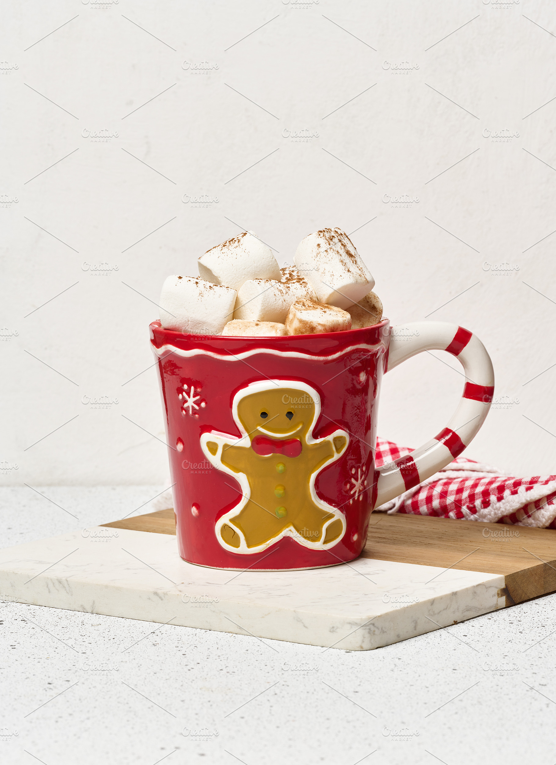 Hot chocolate with marshmallows in a Christmas mug with a ginger, a Food & Drink Photo by ndanko