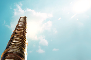 Golden Coins stacked high toward sunlight sky, Financial freedom, a Photo by salmon.black