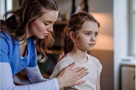 Little girl doing exercise with a, a Health & Medical Photo by HalfPoint