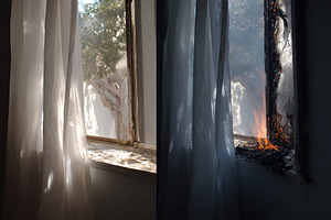 Fire damage visible through window as light filters in during the day, a Photo by AlyaAnd