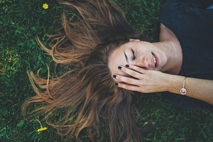 Happy smiling girl featuring lying, woman, and grass