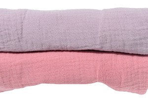 Stack of folded cotton towels in pastel shades on isolated backg, an Abstract Photo by ndanko