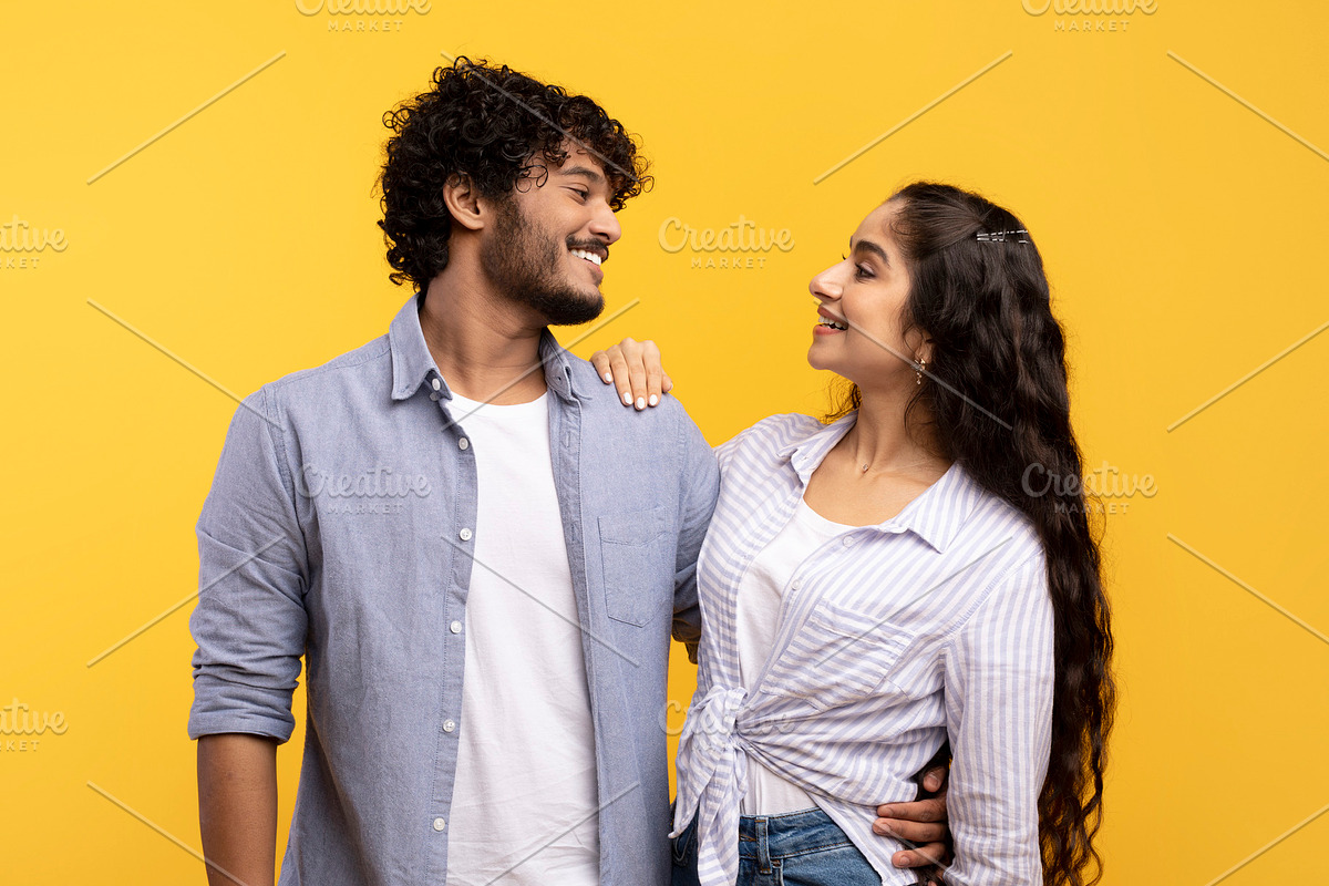 Couple in love. Loving couple embracing, looking and smiling to each other, sta, a Photo by Prostock-Studio (Photo 2 of 4)