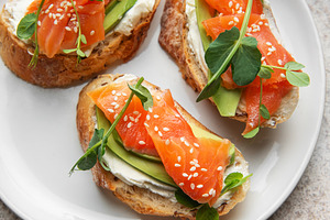 Salmon avocado bruschetta with cream cheese and lemon, a Food & Drink Photo by Olena Rudo