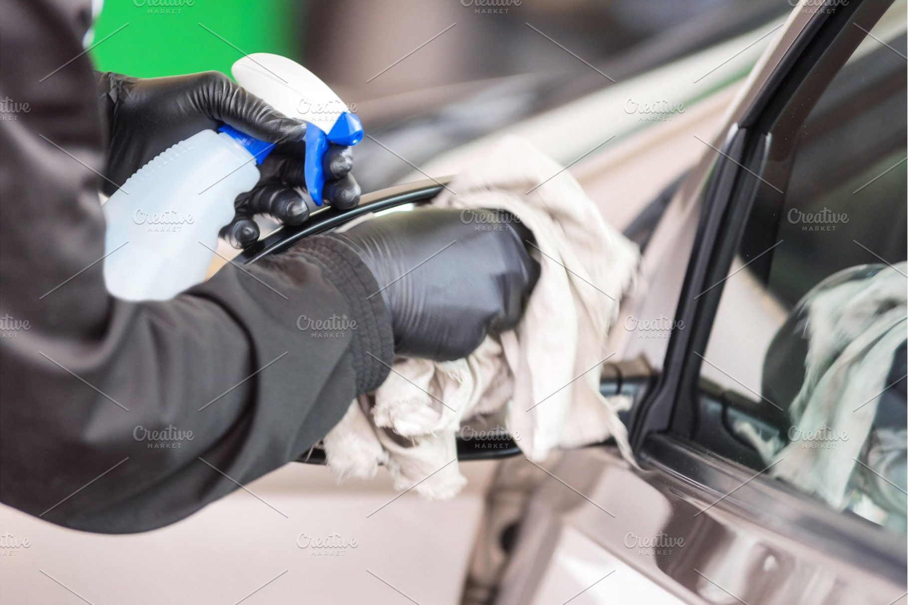 Hand with cloth cleaning the car, a Person Photo by david.herraez.calzad
